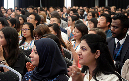 Scholars in auditorium