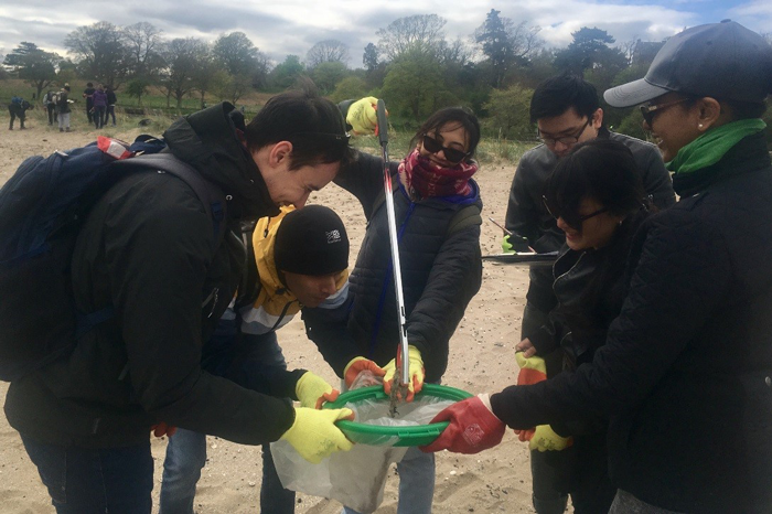 Scholars picking litter