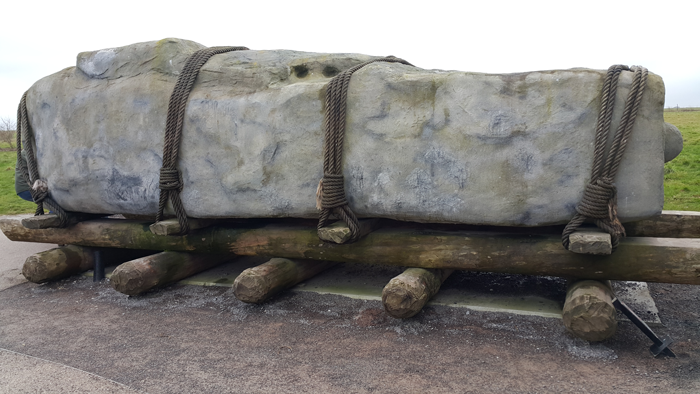 Stonehenge stone on logs