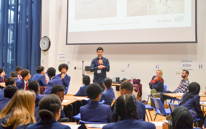 Yasser speaks to students with Solutions Not Sides