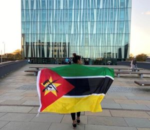 A woman holding a flag.