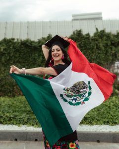 Olivia holding her country's flag