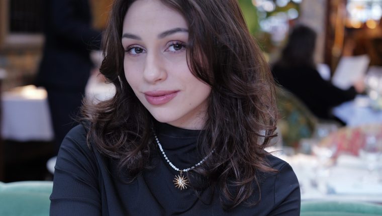 Woman looking at a camera smiling