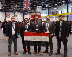 Scholars hold flag at Chevening Orientation event.