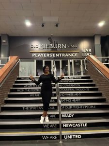A woman standing on stairs