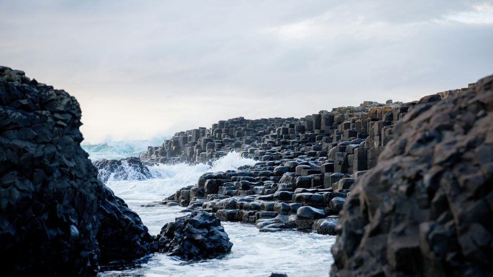 Picture of Giants Causeway in Northern Ireland with the sea hitting the rocks