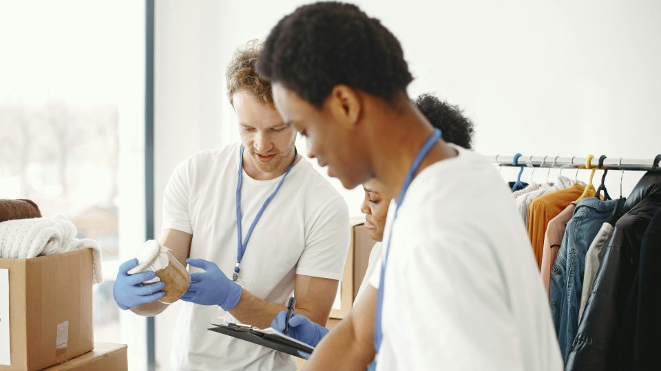 Two people looking at items in their hands